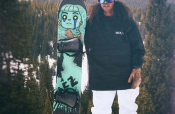 The picture shows a man with a snowboard made in collaboration of DeadFellaz NFT and Gilson