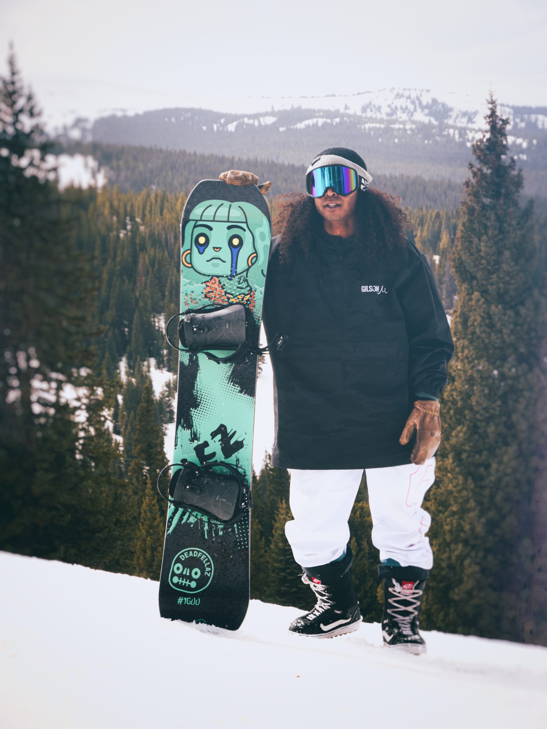 The picture shows a man with a snowboard made in collaboration of DeadFellaz NFT and Gilson