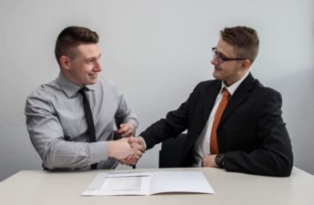 Job seeker and employer shaking hands