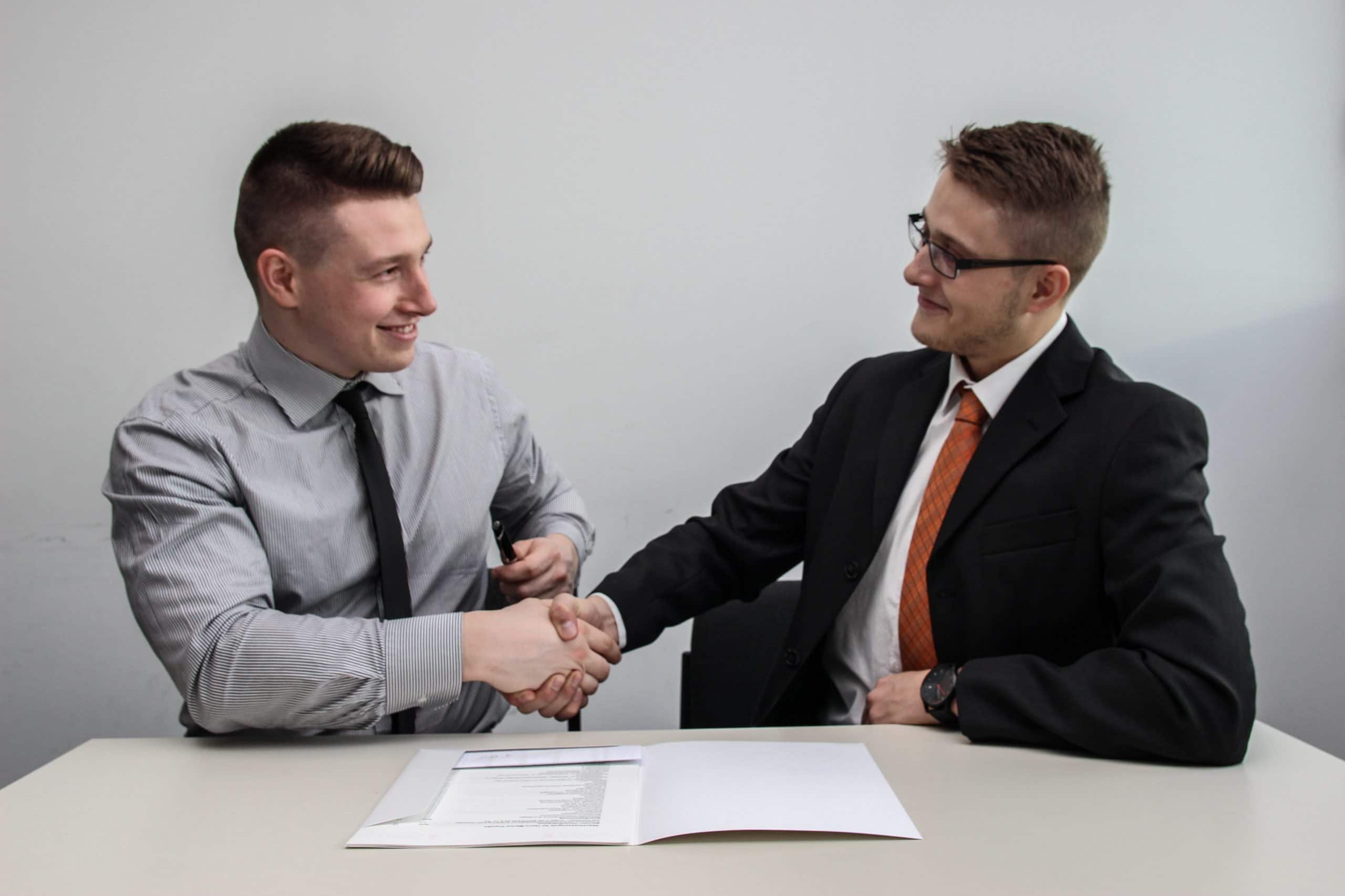 Job seeker and employer shaking hands