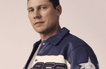 DJ and producer Tiësto in a blue and white jacket